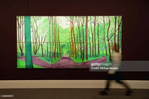 vibrant artwork depicting a lush green forest with a winding path.