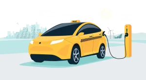 A yellow electric taxi charging in an urban setting.