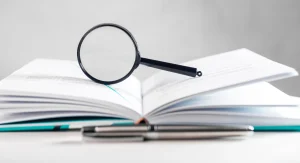 Magnifying glass resting on an open book