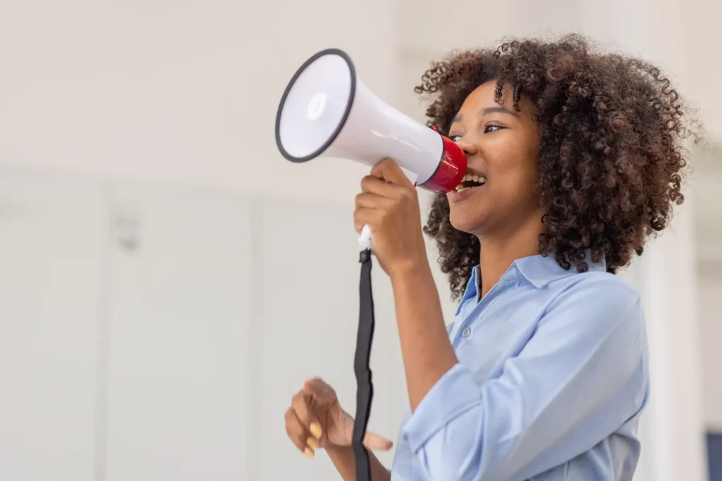 Woman speaking through a megaphone