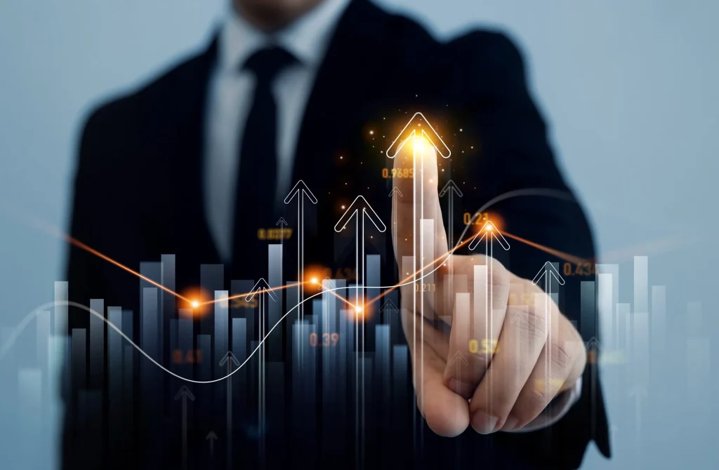Businessperson pointing to a rising growth chart
